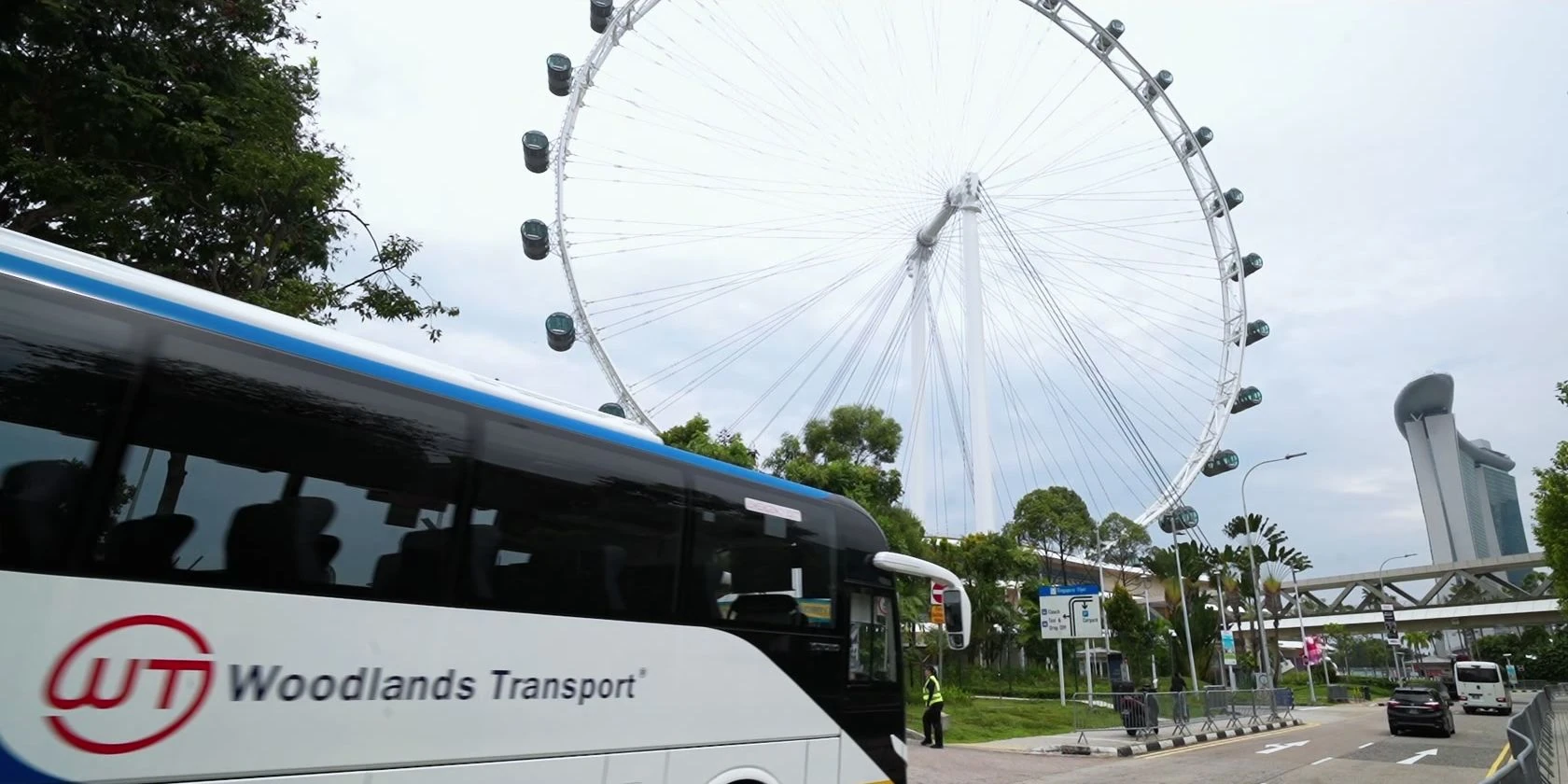 Woodlands Transport coach beside the Singapore Flyer