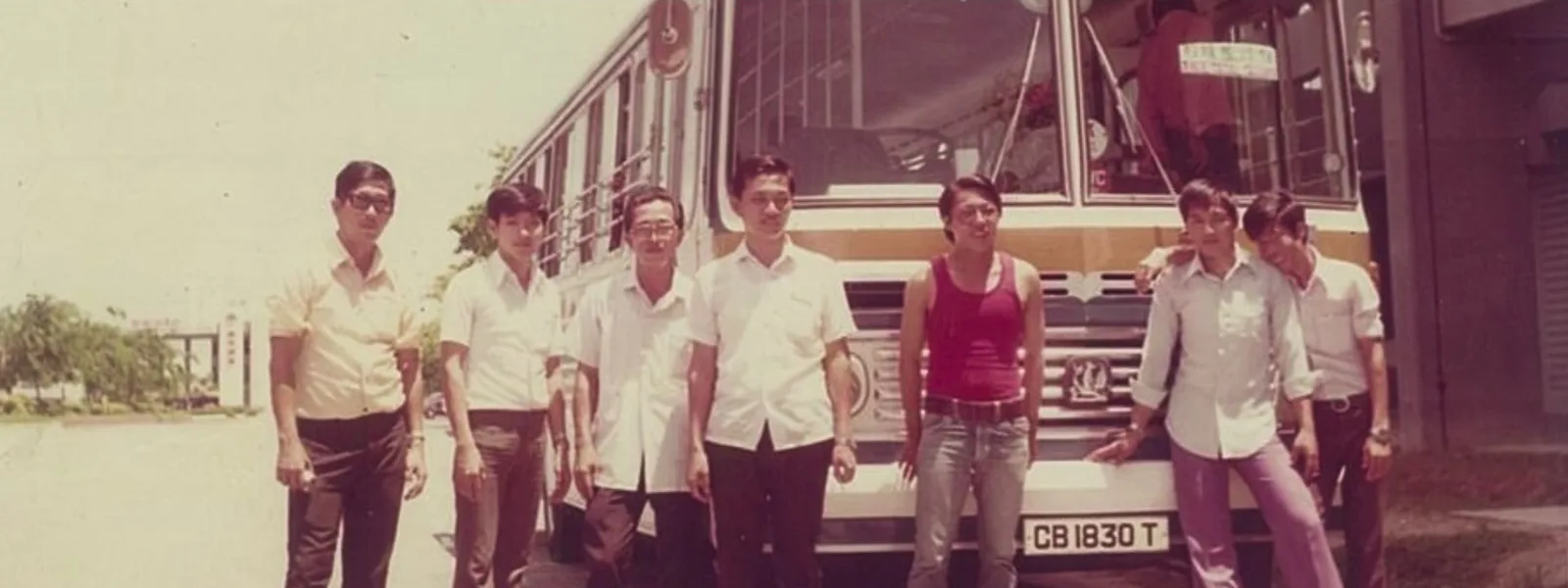 An archive photograph of a bus team beside their vehicle