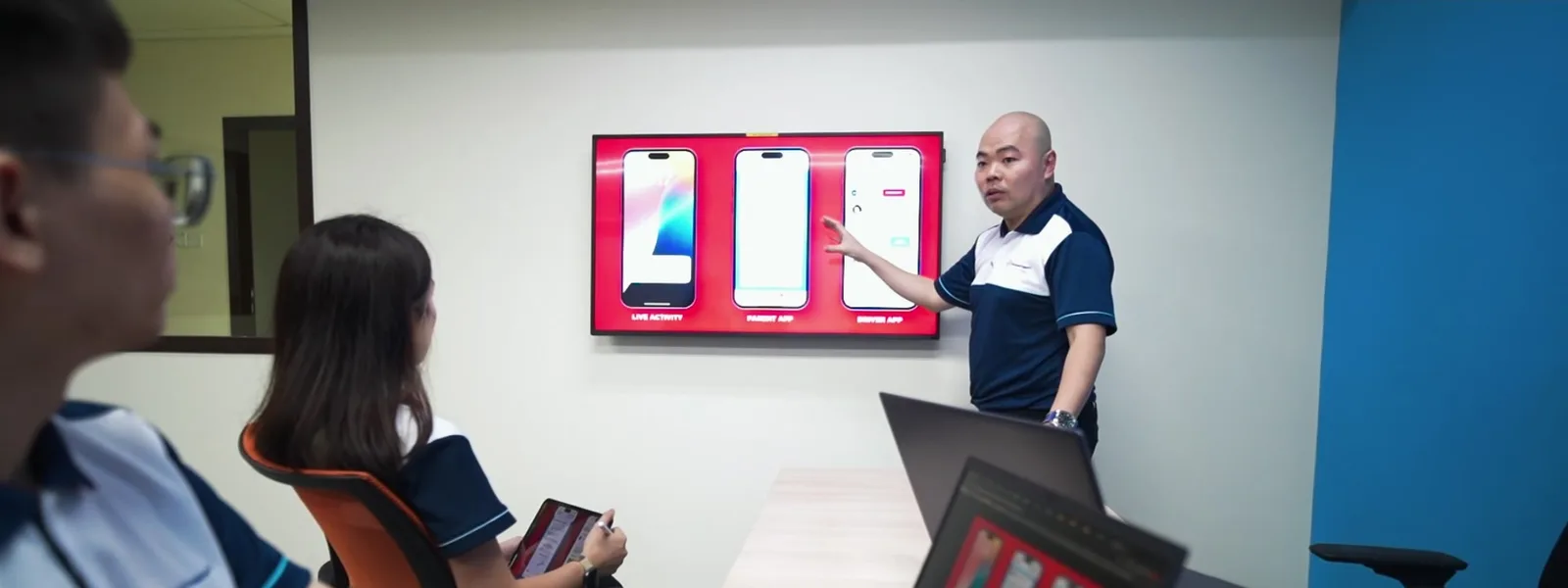 Plotigo colleagues presenting a mobile interface